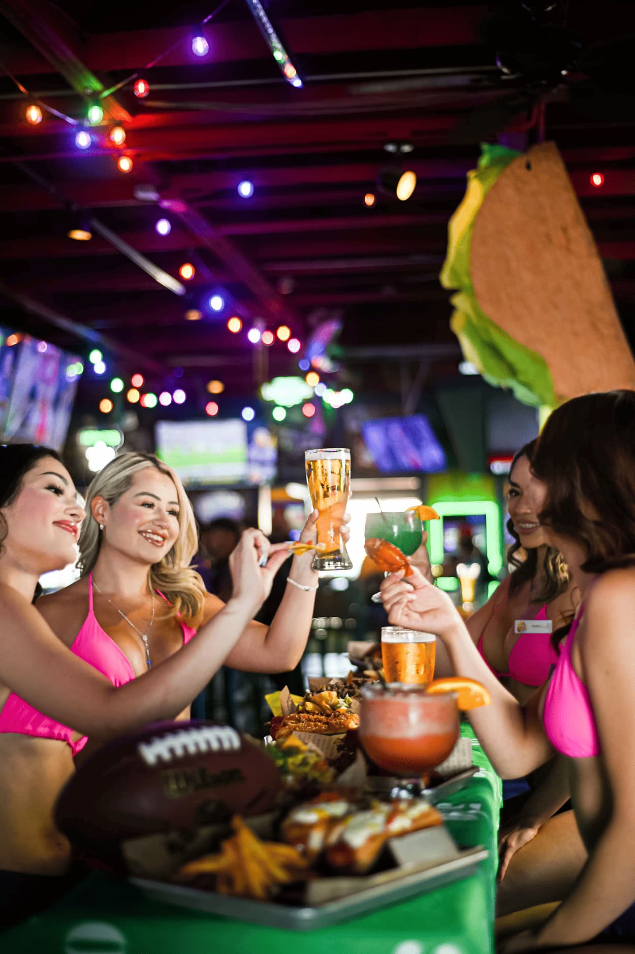 Friends toasting with beer and cocktails at Cabo Joe's
