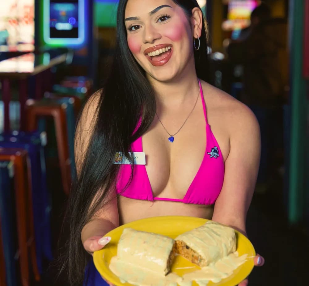 Cabo Joe's server holding a burrito for Saturday specials