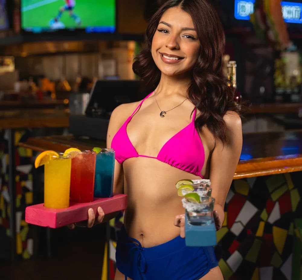 Cabo Joe's server with margarita flights for Sunday specials