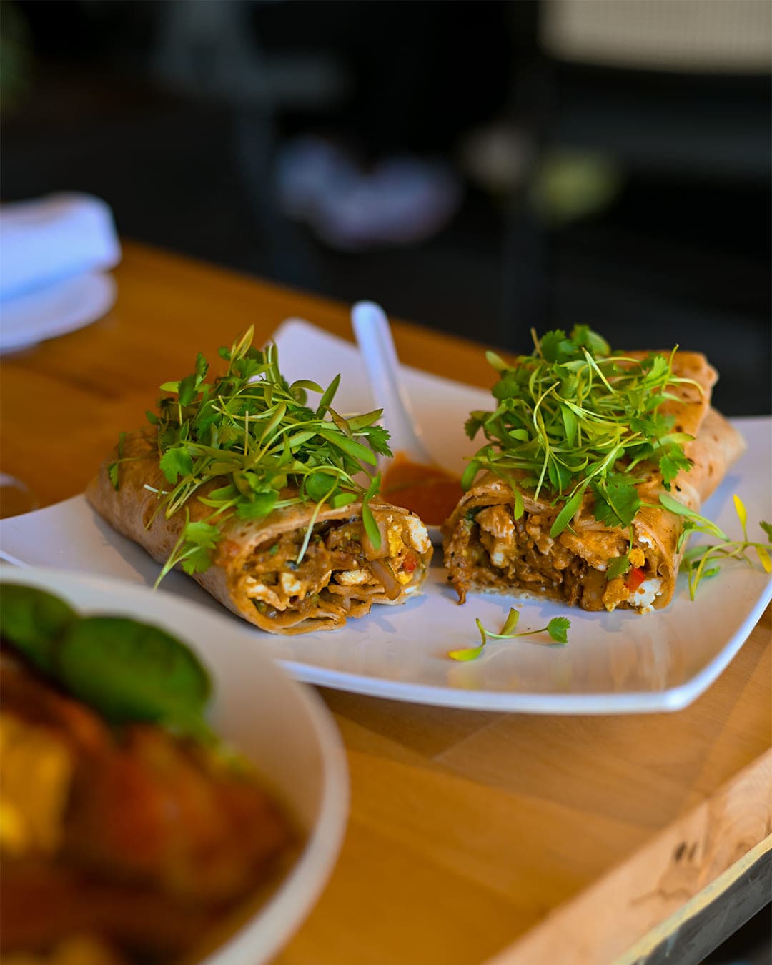Grilled chicken wrap topped with fresh cilantro at Cabo Joe's