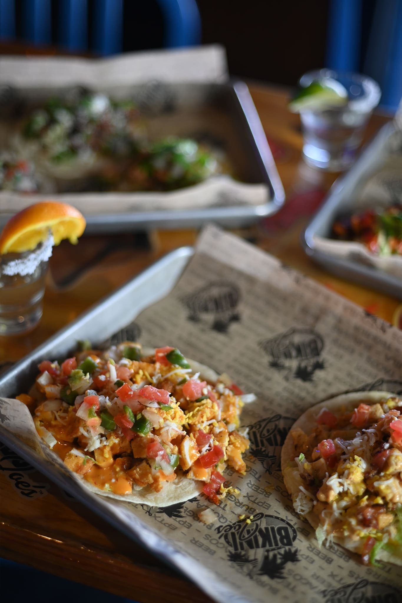 Tostadas loaded with pico de gallo and cheese on a tray at Cabo Joe's